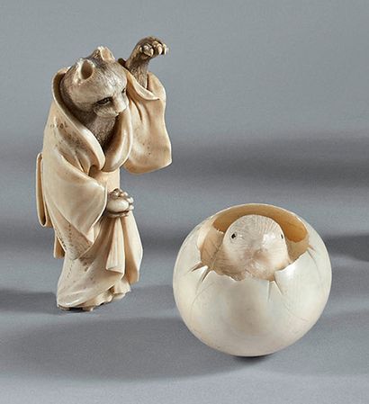 JAPON - Epoque MEIJI (1868-1912) 
Two small okimono in ivory, badger standing disguised...