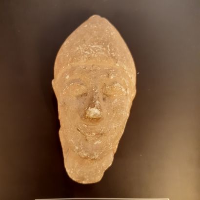 null 
Male head wearing a pointed cap from a votive statuette. Beige limestone.



Cyprus,...