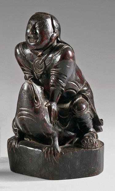 CHINE - XIXe siècle 
Statuette en bois sculpté de Liu hai assis sur son crapaud à...