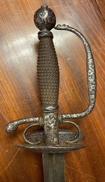 null Court sword. Copper filigree fuse. Iron frame with chased and inlaid decoration...