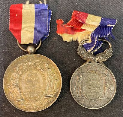 null Second Empire - Lot of two medals for courage and devotion with laureate profile...