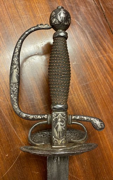 null Court sword. Copper filigree fuse. Iron frame with chased and inlaid decoration...