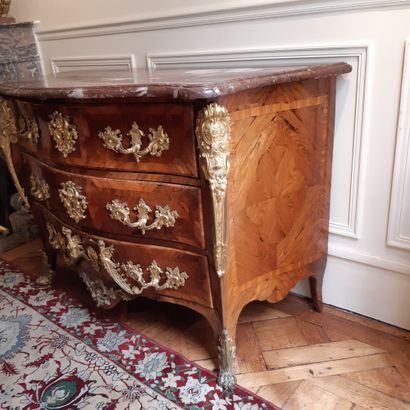 null Curved chest of drawers in violet wood veneer opening to three drawers, the...