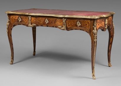  A flat desk with an ormolu top with ormolu corner pieces and astragals. Inlaid belt...