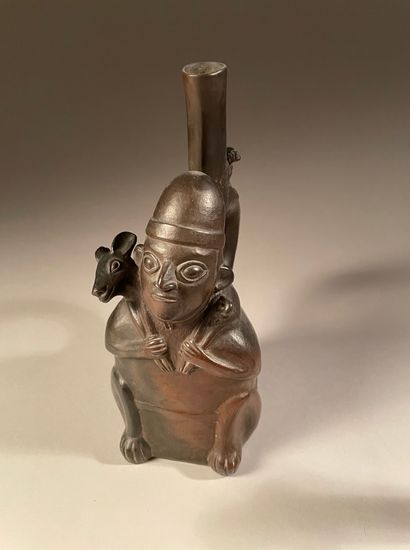 null Vase representing a figure carrying a deer.
Chimu culture, Northern Peru.
Late...