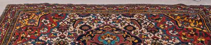 null Carpet decorated with three medallions on a white background with spandrels...