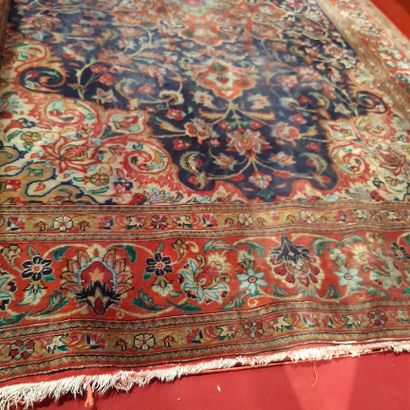 null Small modern Persian carpet decorated with a medallion and spandrels on a blue...
