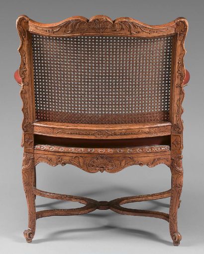 null Beechwood caned desk armchair with curved back and waist, carved on all sides...