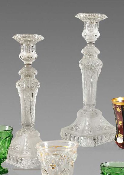 null A pair of moulded crystal torches decorated with old men's heads, swans and...