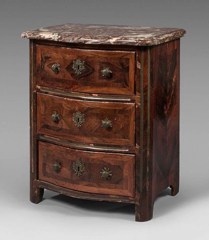 null Small chest of drawers with a curved front opening to three drawers in rosewood...
