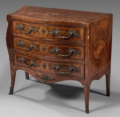 null Curved chest of drawers inlaid with poly-lobed motifs in circles, opening to...