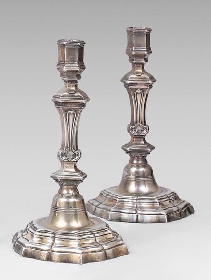 null A pair of silver torches, partially vermeiled, standing on a round base with...