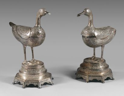null Two silver-plated openwork duck-shaped incense burners on octagonal bases.
Iranian...