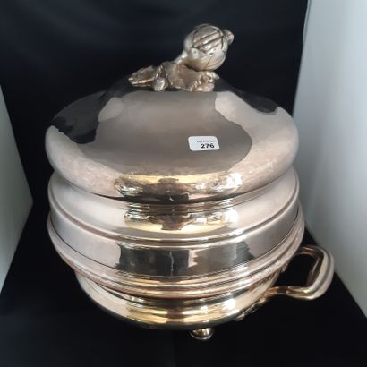 null Lined metal stove, round shape with handle on ball feet, and a round bell, the...