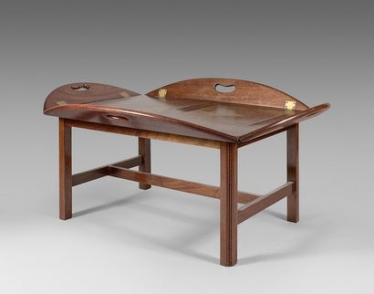 null Low table in mahogany made up of a marine tray with folding edges with brass...