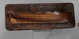 Model of a half-hull boat, in walnut and...