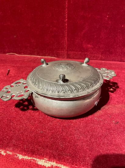 null Pair of pewter covered delivery bowls with openwork ears. Lid with three skids....