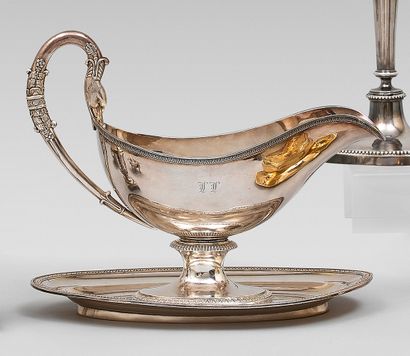 null Sauceboat and its oval plate in plain silver and monogrammed 950 thousandths...