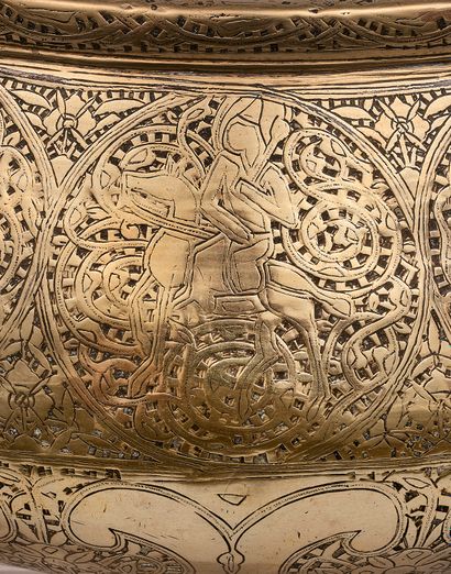 null Basin from the Fars region. 
 Brass with engraved decoration and inlaid with...