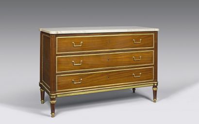 null Mahogany chest of drawers with ormolu mouldings opening to three drawers. Round...