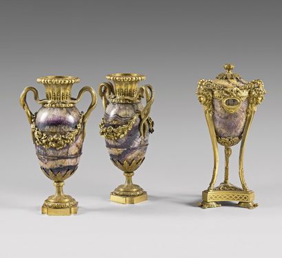 null A pair of fluorspar baluster vases with rich ormolu ornamentation: fluted neck,...