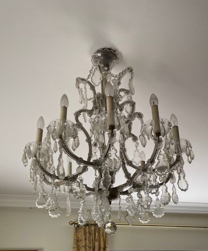 null Ten arms crystal chandelier decorated with pendants and strings of faceted glass...