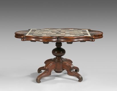 null Oak pedestal table with a poly-lobed top decorated with a checkerboard of inlaid...