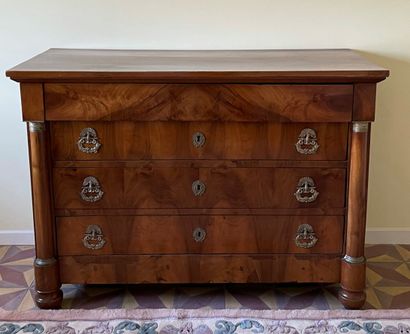null Mahogany chest of drawers opening with four drawers, the top one overhanging....