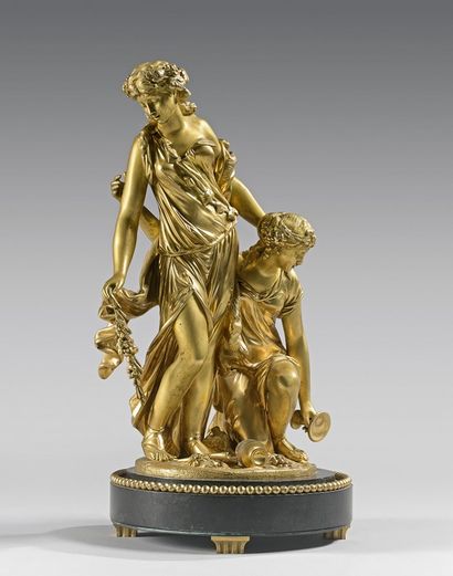 null Statuette en bronze doré représentant deux bacchantes. Socle en marbre noir...