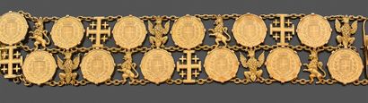  Bracelet large et articulé en or jaune 750 millièmes orné de pièces en or, alternées...