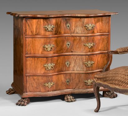 null Walnut chest of drawers with crossbow front, opening with four drawers. Claw...