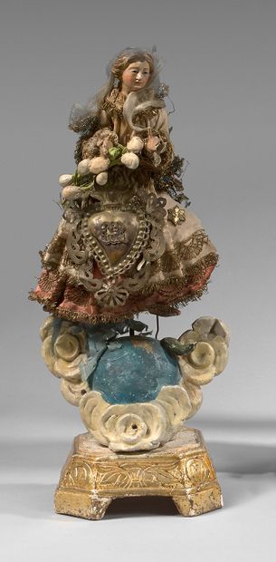 null Statuette of a Virgin in polychrome carved wood, on a globe resting on clouds.
Height...