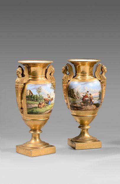 null A pair of gilt and glossy porcelain baluster vases decorated with polychrome...