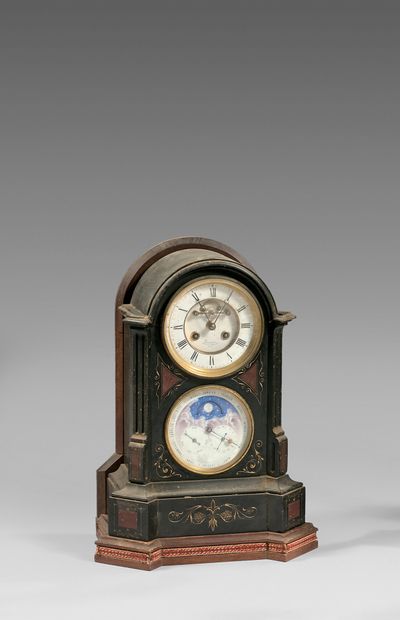 null Black marble clock with inlays of griotte marble. Ring-shaped dial with apparent...