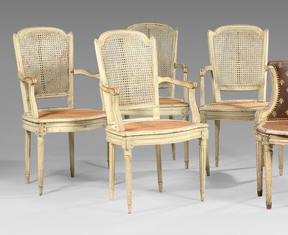 null Four cane armchairs with basket handle cabriolet back in white lacquered walnut....