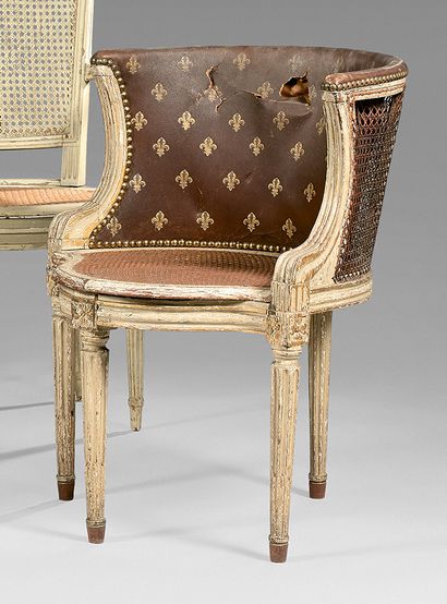 null Beechwood caned desk armchair with white relacquered and gilded finish. Fluted...