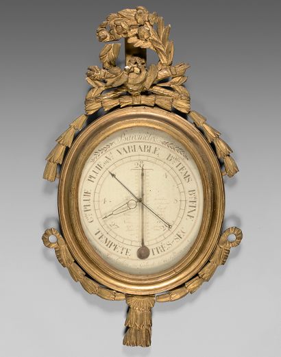 null Barometer-thermometer in an annular frame in carved wood with a crown of laurels...