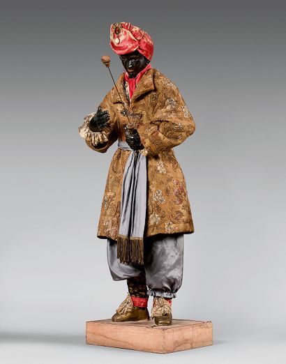 null Large oriental character with composition head and papier-mâché body, late 19th...