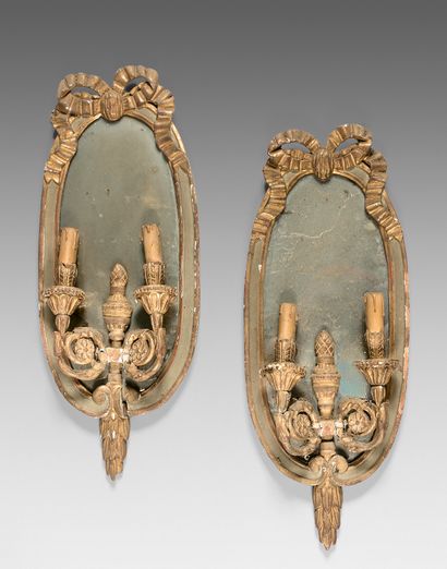 null Pair of sconces with two arms of lights with mirrors. Framed with a wooden pediment...
