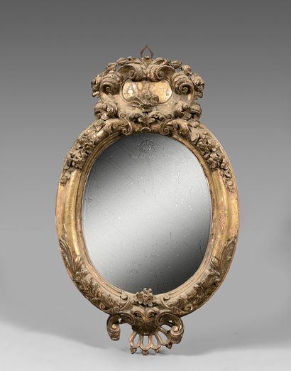 null Oval mirror in a gilded wood frame carved with foliage.
Louis XV style. (Damage...