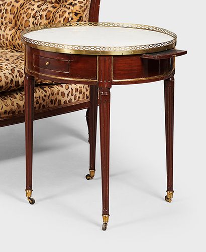 null Mahogany bouillotte table, opening with two drawers and two shelves, fluted...