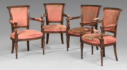 null Suite of four armchairs with reversed cabriolet back in patinated beech. Armrests...