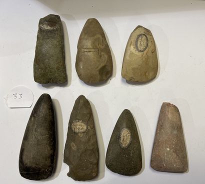 null Lot including an unfinished axe with rectangular section and six polished axes_x000D_.

Grey...