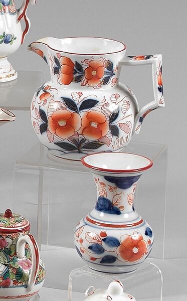 null BAYEUX

Bottle, milk jug and neck vase decorated in blue, red and gold with...