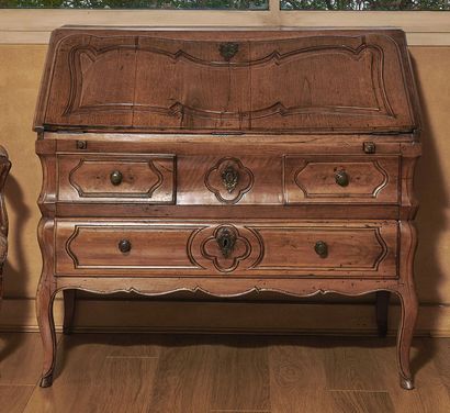 null Walnut scriban chest of drawers opening to a molded flap revealing a locker...