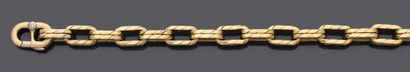 null Bracelet articulé en or jaune 750 millièmes, les maillons de forme ovale.
(bosses).
Poids...