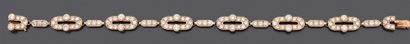 BOUCHERON, signé et numéroté Bracelet articulé en or jaune 750 millièmes, les maillons...