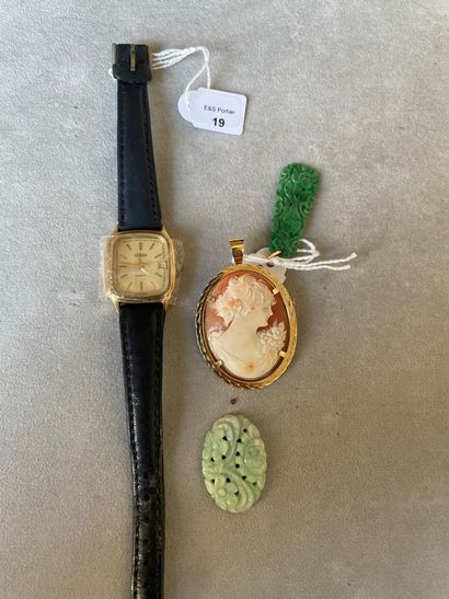 null Lot including: a metal lady's watch bracelet, leather strap; two engraved jade...