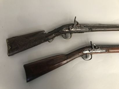 null Two flintlock shotguns transformed to percussion: 

(a) Iron fittings. Stock...