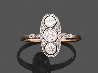 null Lot in gold 585 thousandth comprising: a ring, the oval bezel set with diamonds...